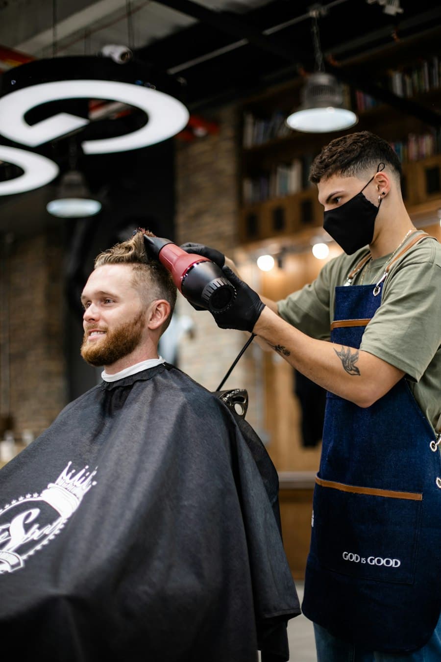 Men's cut being clipped and shaped in the studio chair